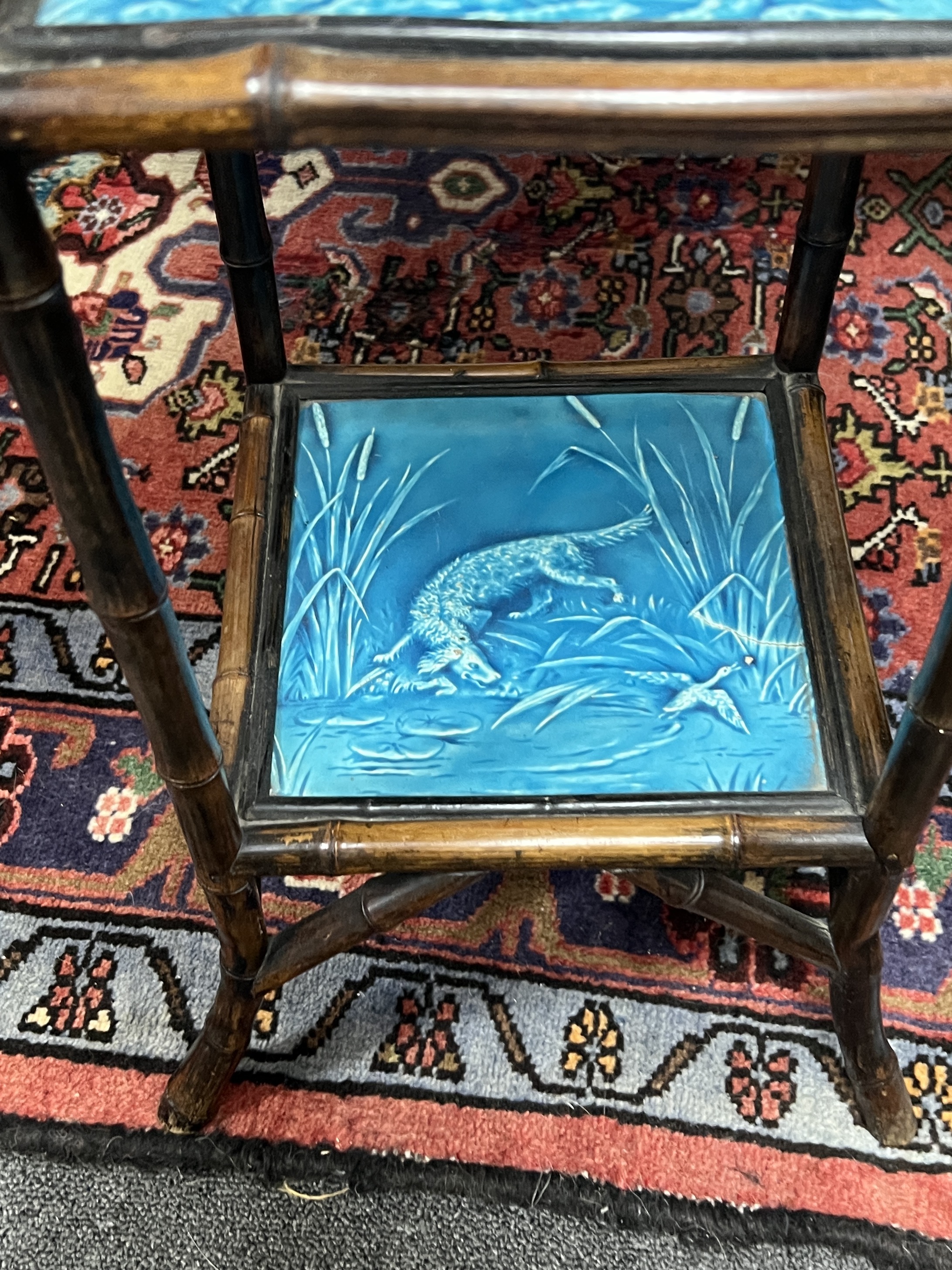 A Victorian Aesthetic movement bamboo and Minton tile inset three tier stand, width 38cm, height 76cm